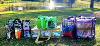 Large medium camping bags toiletry and under bed bags filled with gear